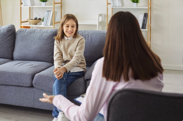 A child talking with a clinician during an ADHD assessment