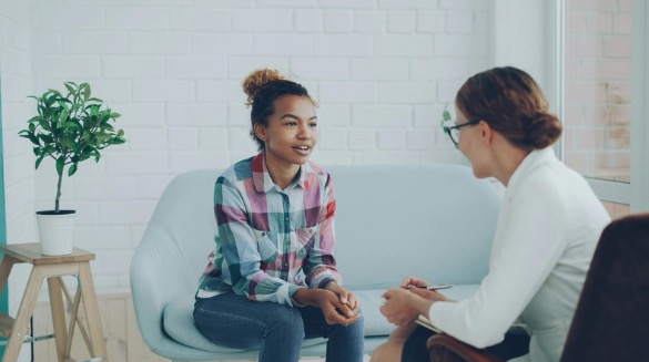A young person in an interactive, conversation-based autism assessment session