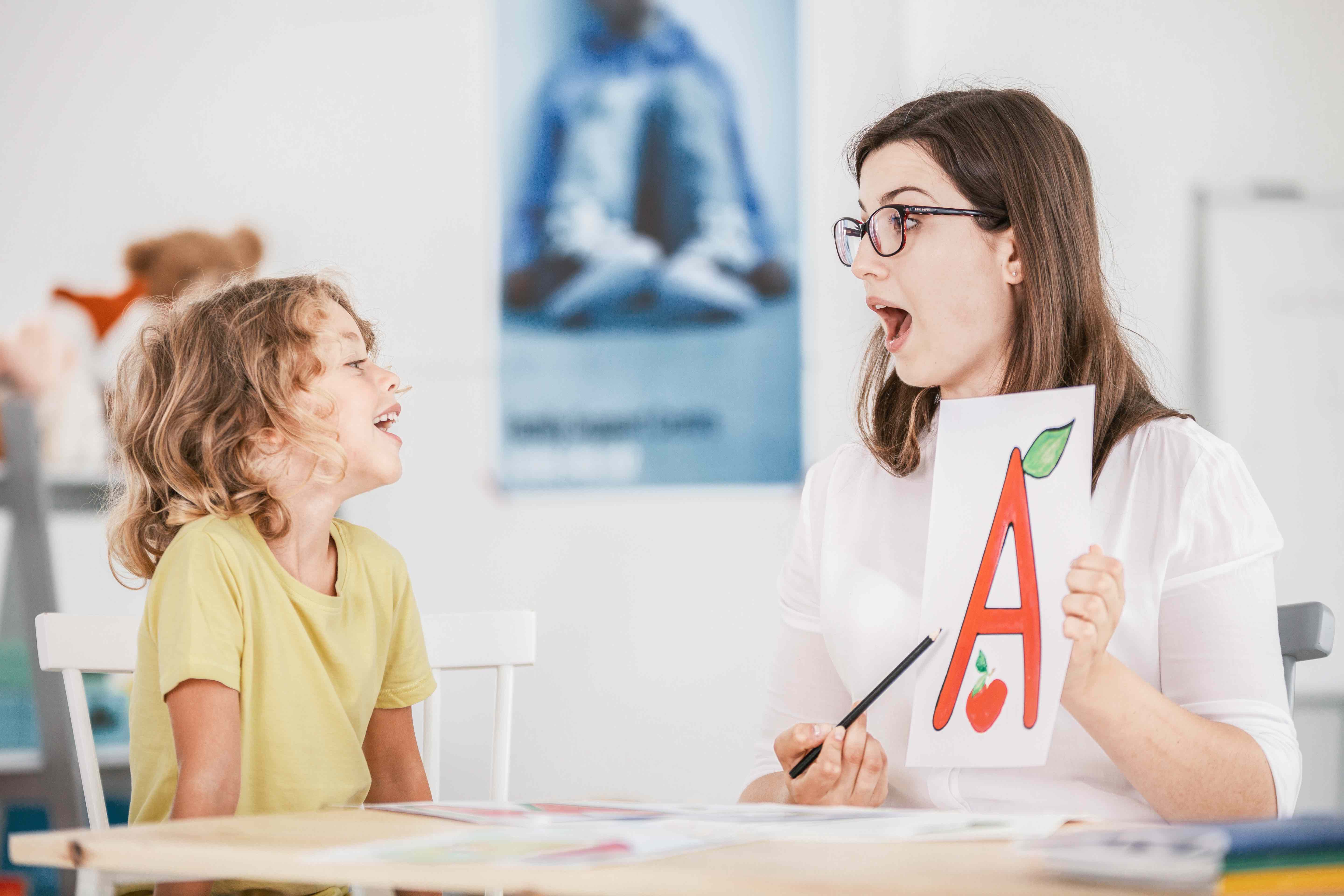 Picture of a speech therapist with a child