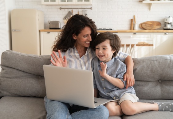 Parent and child on a video call during a telehealth appointment